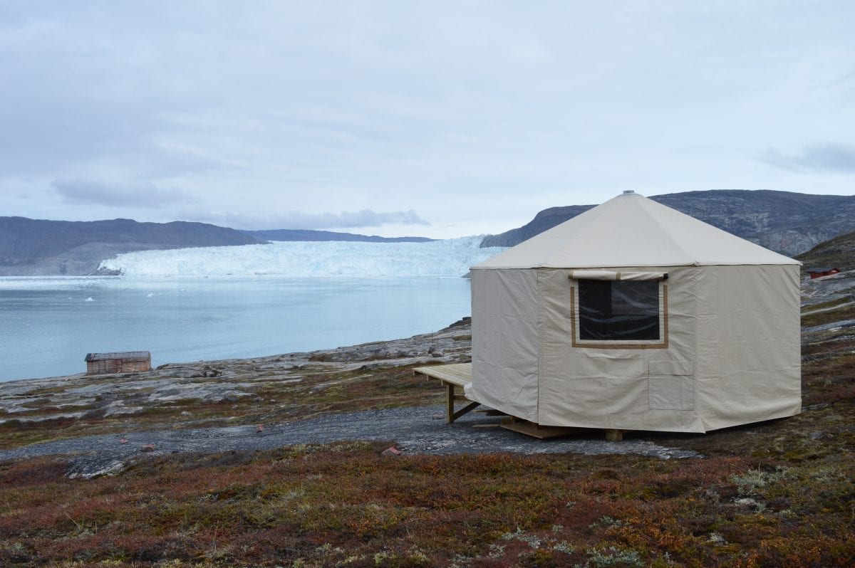 Wilderness tents with a great view of the calving glacier in the bagground - Photographer: Mads Asbjoern Klausen